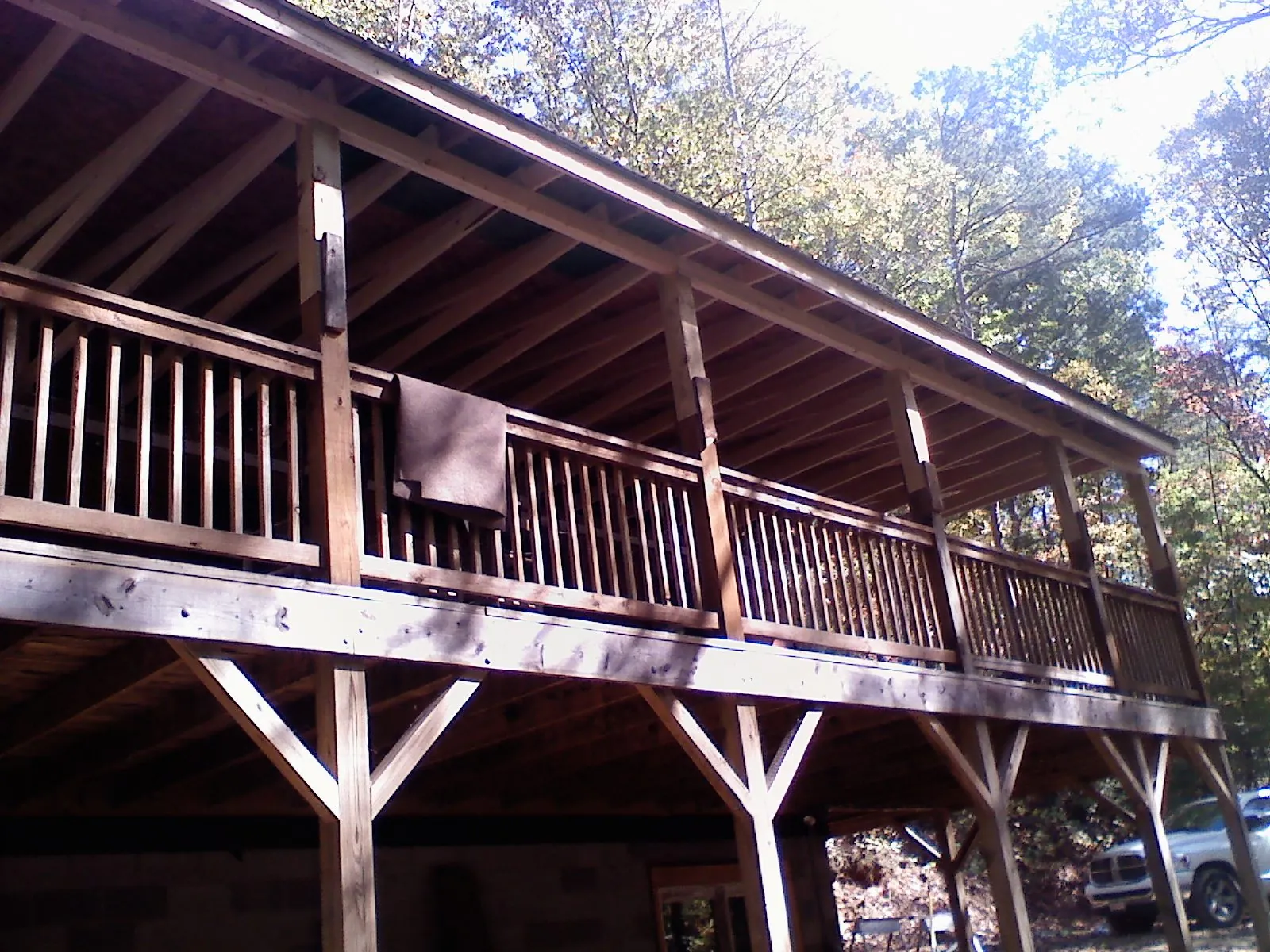 Timber framing under a new elevated porch and deck — Roof Leak Repair in Etna Green by Roofing Brothers